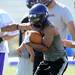 Pioneer's Zak Davis runs the ball during a morning practice at Pioneer High School on Monday. Melanie Maxwell I AnnArbor.com